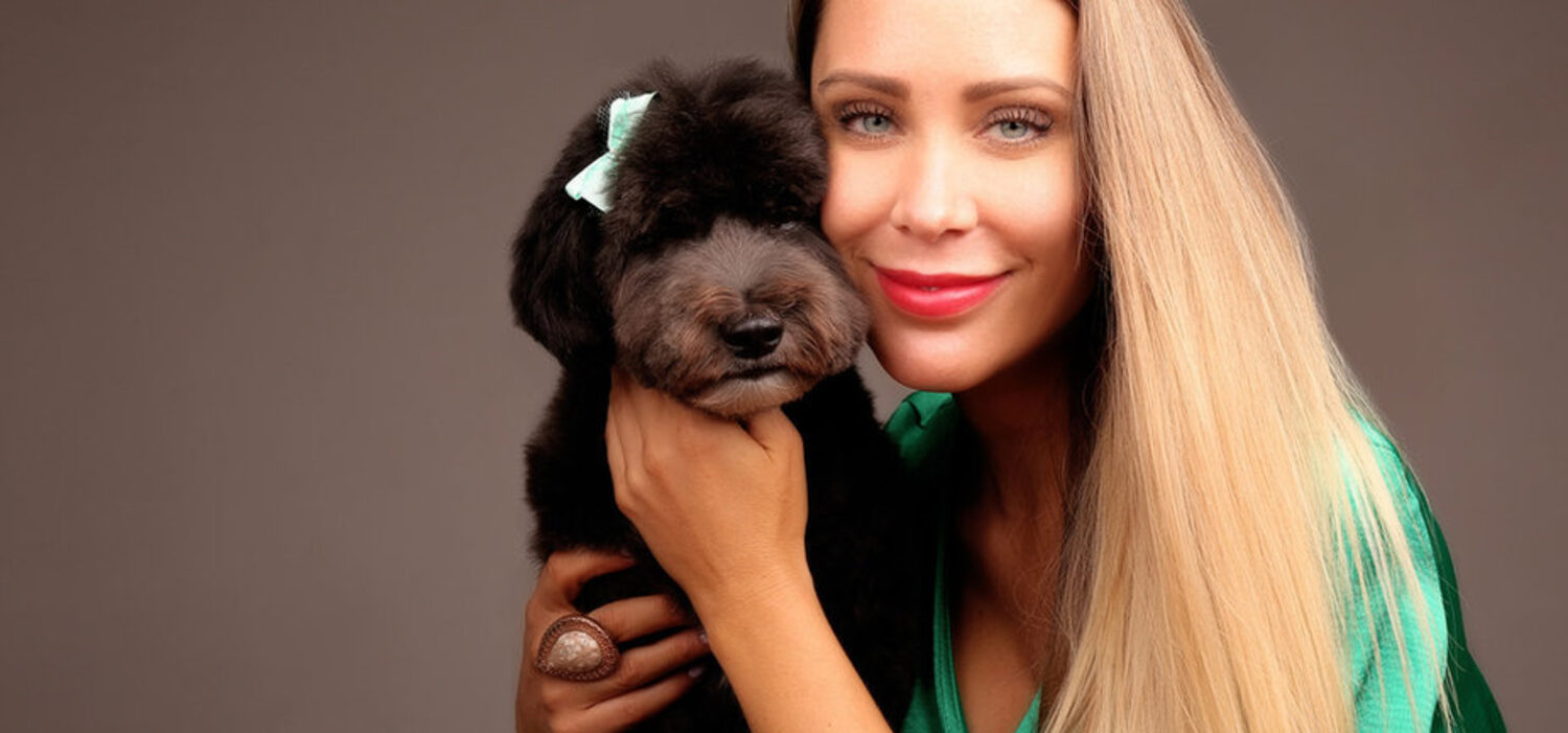 Imogen of Flawless Paws with a freshly groomed dog